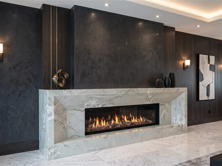 Mont Blanc Quartzite fireplace surround with mitered edges, a matching mantel and continuous natural veining in a modern luxury living room