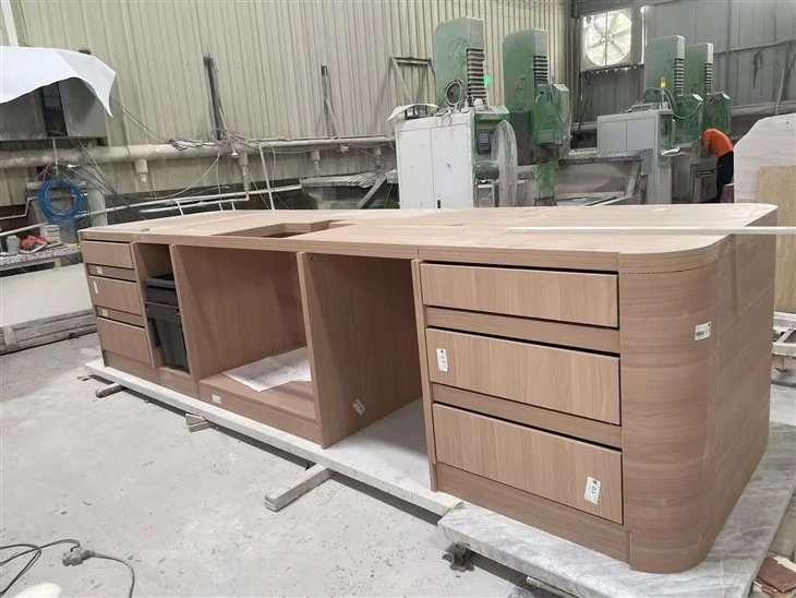 Custom multilayer solid-wood kitchen island cabinet with drawers, appliance spaces and large curved ends.