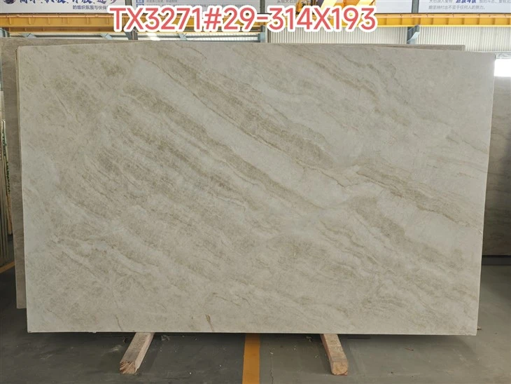 Full Taj Mahal Quartzite slab presented for client approval before cutting long fluted tiles