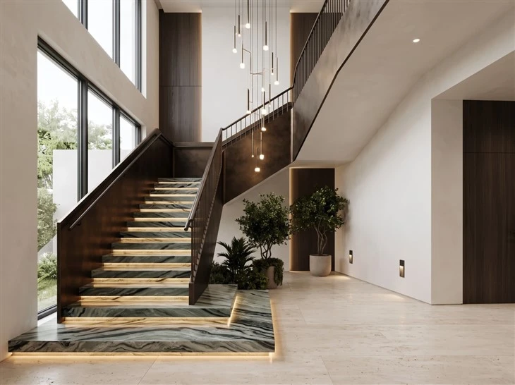 Verde Oceania Marble interior staircase with illuminated treads, matching landing and flowing green and black veining in a modern luxury home