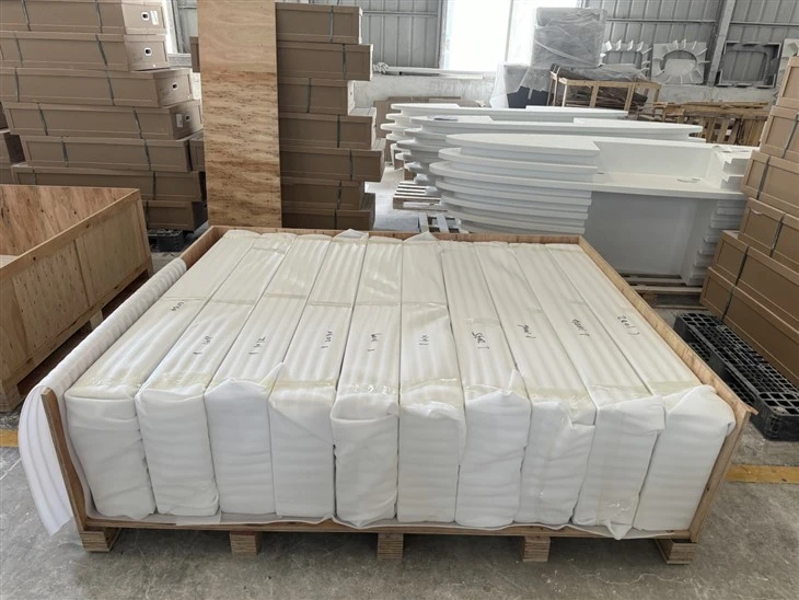 Individually numbered acrylic countertops wrapped in thick protective foam and separated inside a custom export crate.