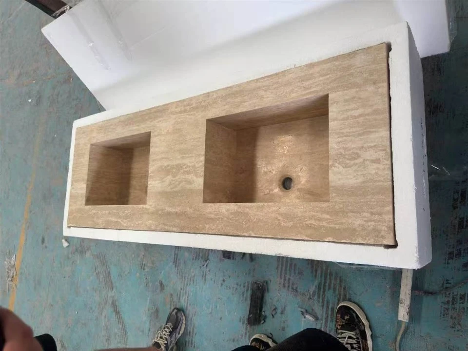 Classic Beige Travertine integrated sink countertop positioned in a custom foam box for impact and edge protection.