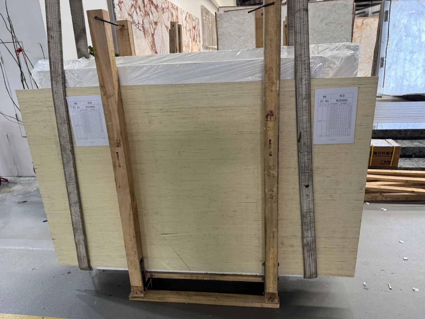 Thassos White Marble slabs protected and secured in a timber frame before export shipment. Thassos White Marble slabs protected and secured in a timber frame before export shipment.