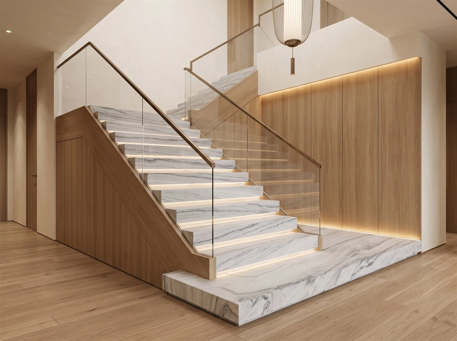 Luce Di Luna quartzite interior staircase with stone treads, matching risers, glass railings and warm wood side panels Luce Di Luna quartzite interior staircase with stone treads, matching risers, glass railings and warm wood side panels