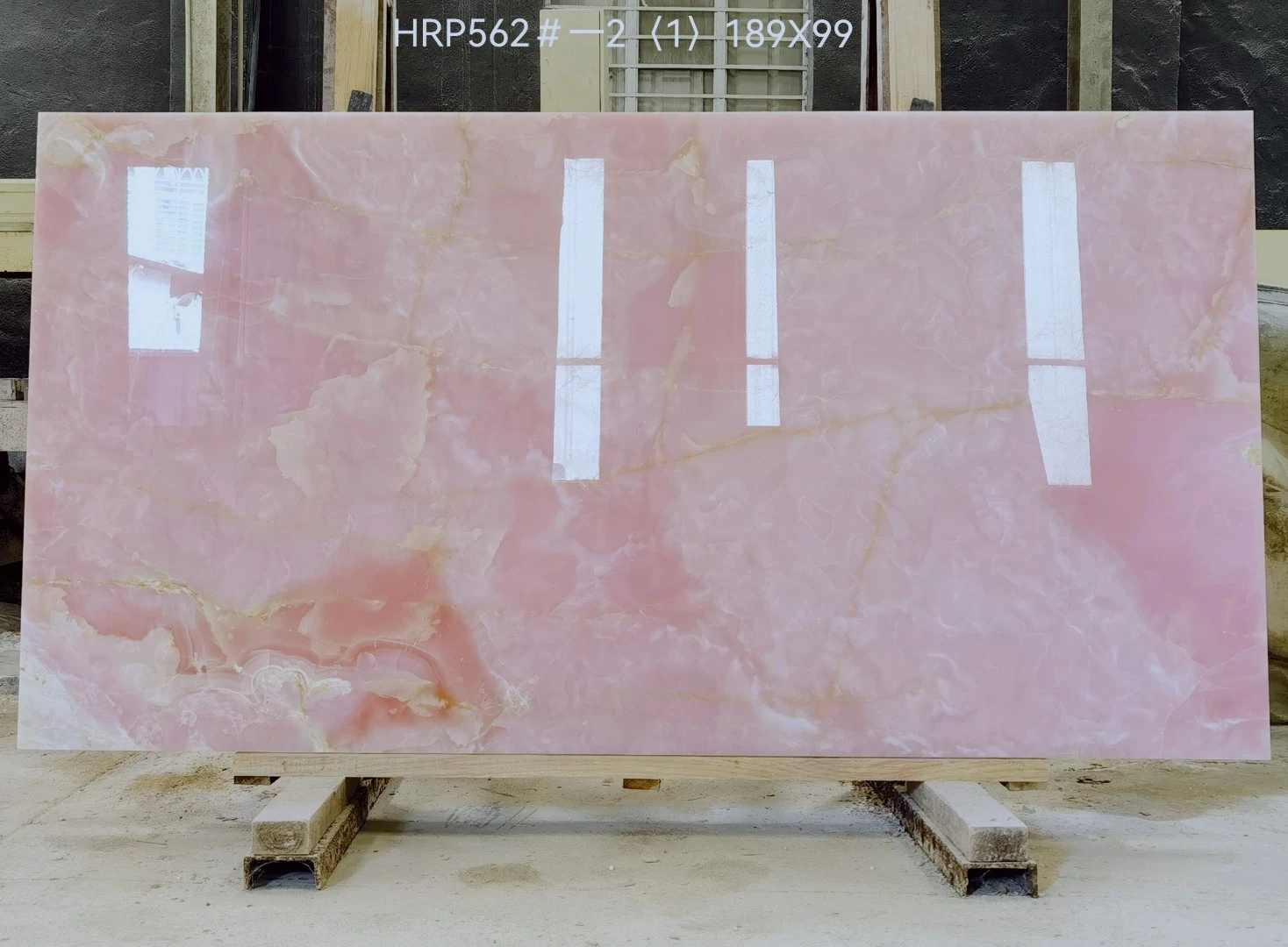Client-approved Afghan Pink Onyx slab with soft pink clouding, cream-white movement and natural tonal variation. Client-approved Afghan Pink Onyx slab with soft pink clouding, cream-white movement and natural tonal variation.