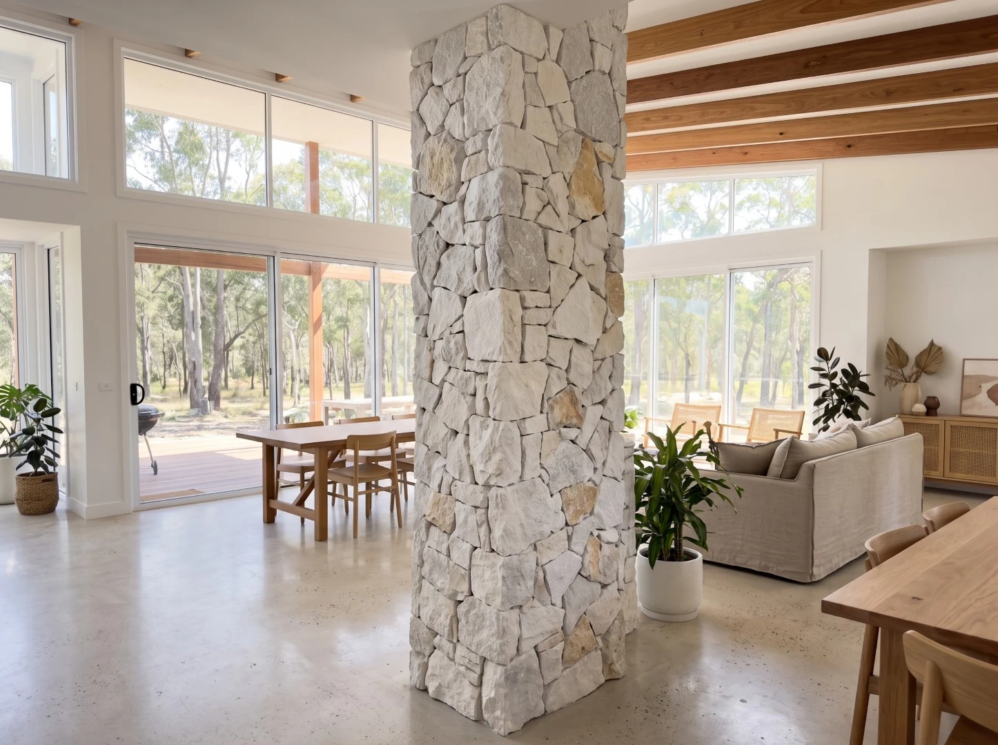 Natural White Quartzite loose random stone wall cladding installed on a floor-to-ceiling square column in a contemporary open-plan living space Natural White Quartzite loose random stone wall cladding installed on a floor-to-ceiling square column in a contemporary open-plan living space