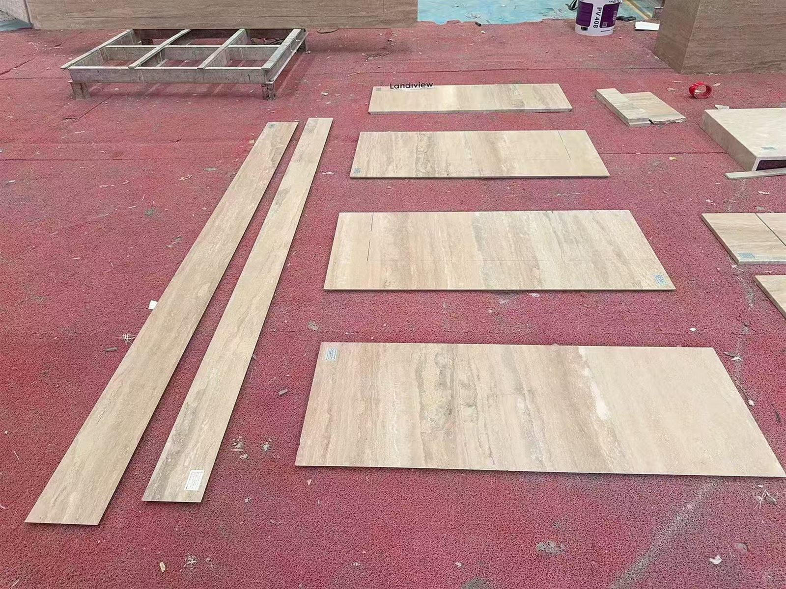Cut Italian Silver Travertine bathtub panels arranged on the factory floor for quality, color, vein direction and component-matching inspection. Cut Italian Silver Travertine bathtub panels arranged on the factory floor for quality, color, vein direction and component-matching inspection.