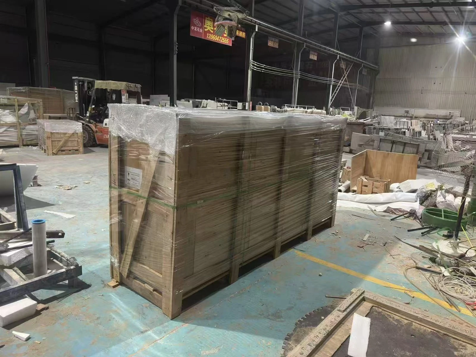 Custom solid-wood export crate containing protected Italian Silver Travertine bathtub panels and wrapped with waterproof film. Custom solid-wood export crate containing protected Italian Silver Travertine bathtub panels and wrapped with waterproof film.