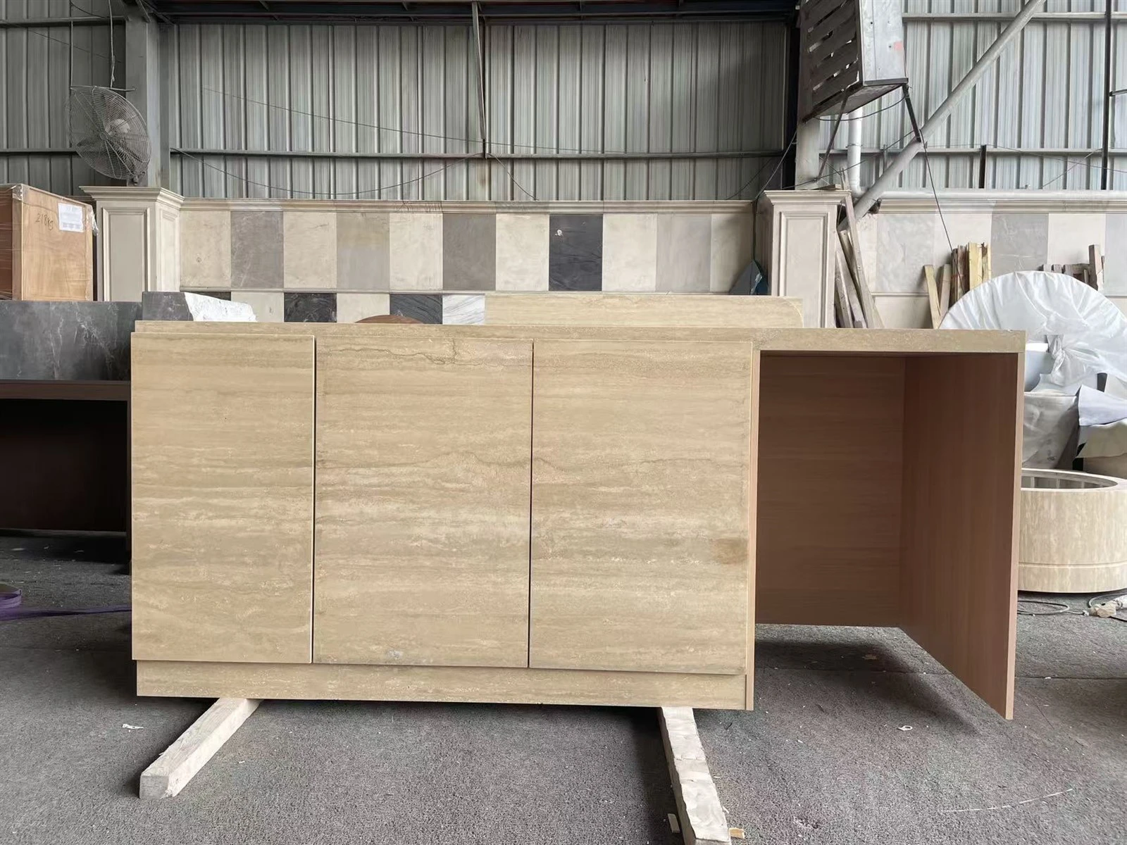 Center kitchen island cabinet module with aligned Silver Travertine door panels and continuous horizontal veining. Center kitchen island cabinet module with aligned Silver Travertine door panels and continuous horizontal veining.