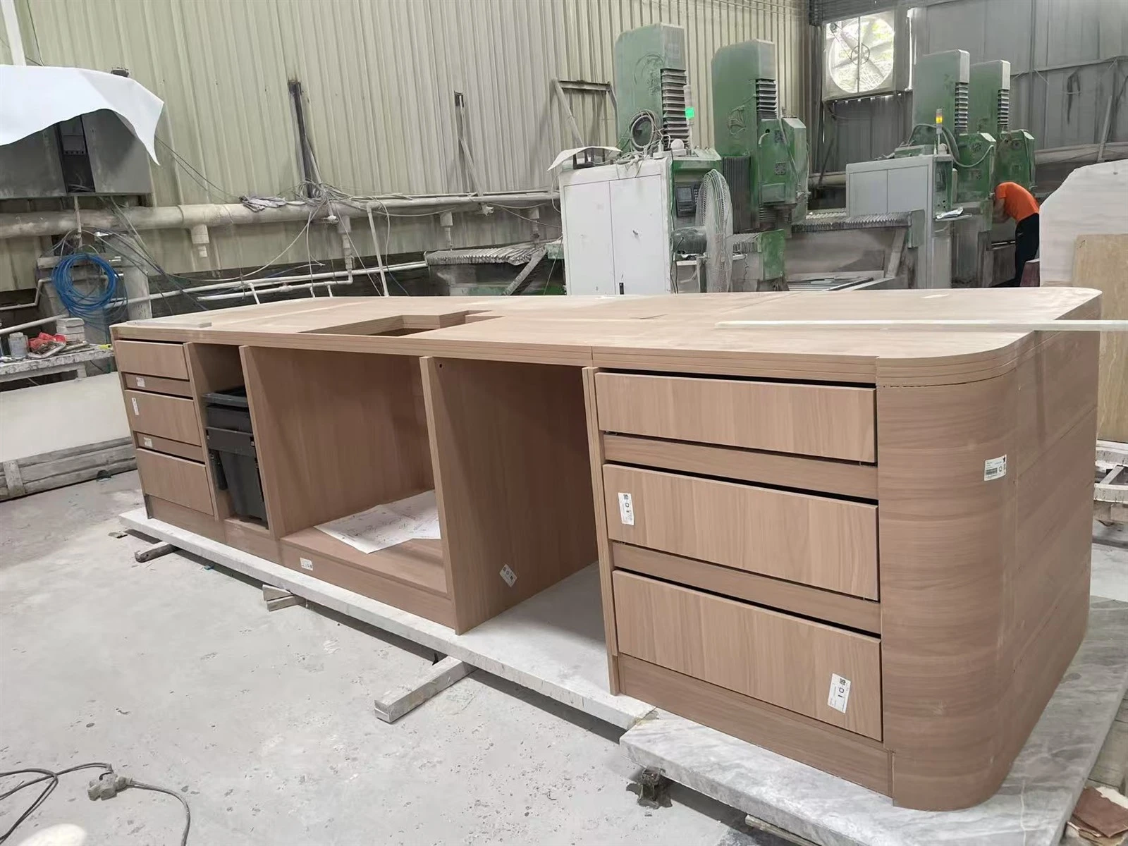 Custom multilayer solid-wood kitchen island cabinet with drawers, appliance spaces and large curved ends. Custom multilayer solid-wood kitchen island cabinet with drawers, appliance spaces and large curved ends.